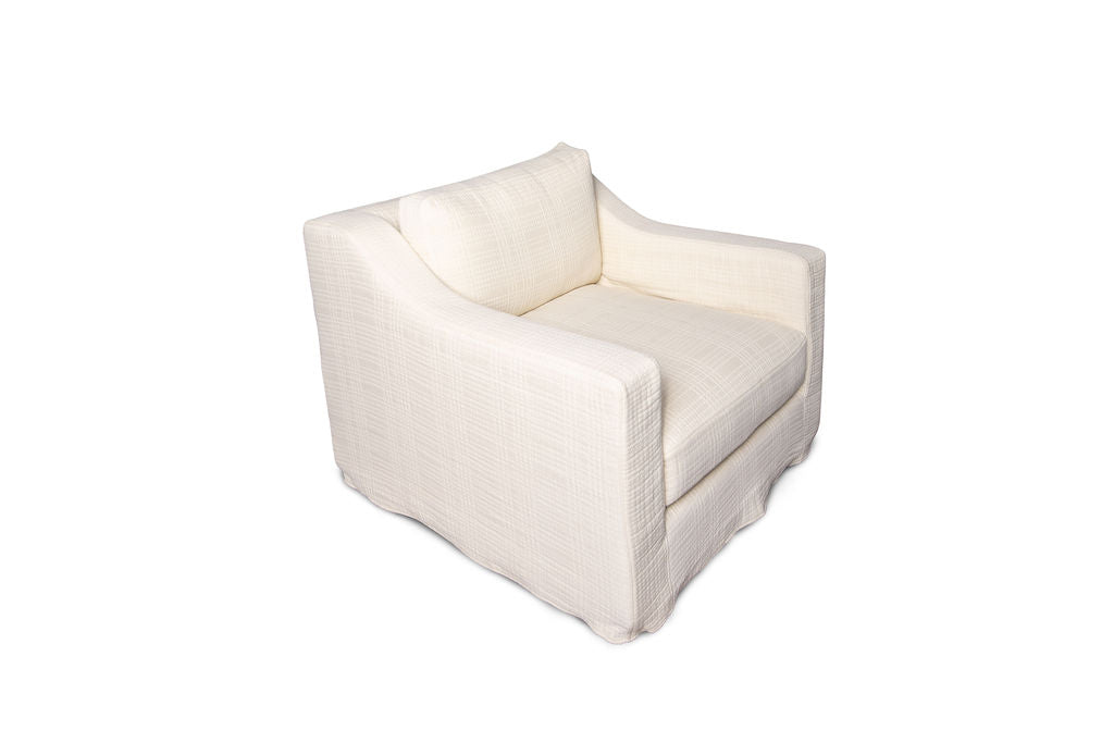Side View of Rue & Williams Home cream-colored custom club chair with matching lumbar pillow, showcasing timeless elegance and comfort. Handcrafted with premium materials, this customizable piece is perfect for elevating any living space. Personalize your comfort with optional fill upgrades. Shop now at Rue & Williams Home.