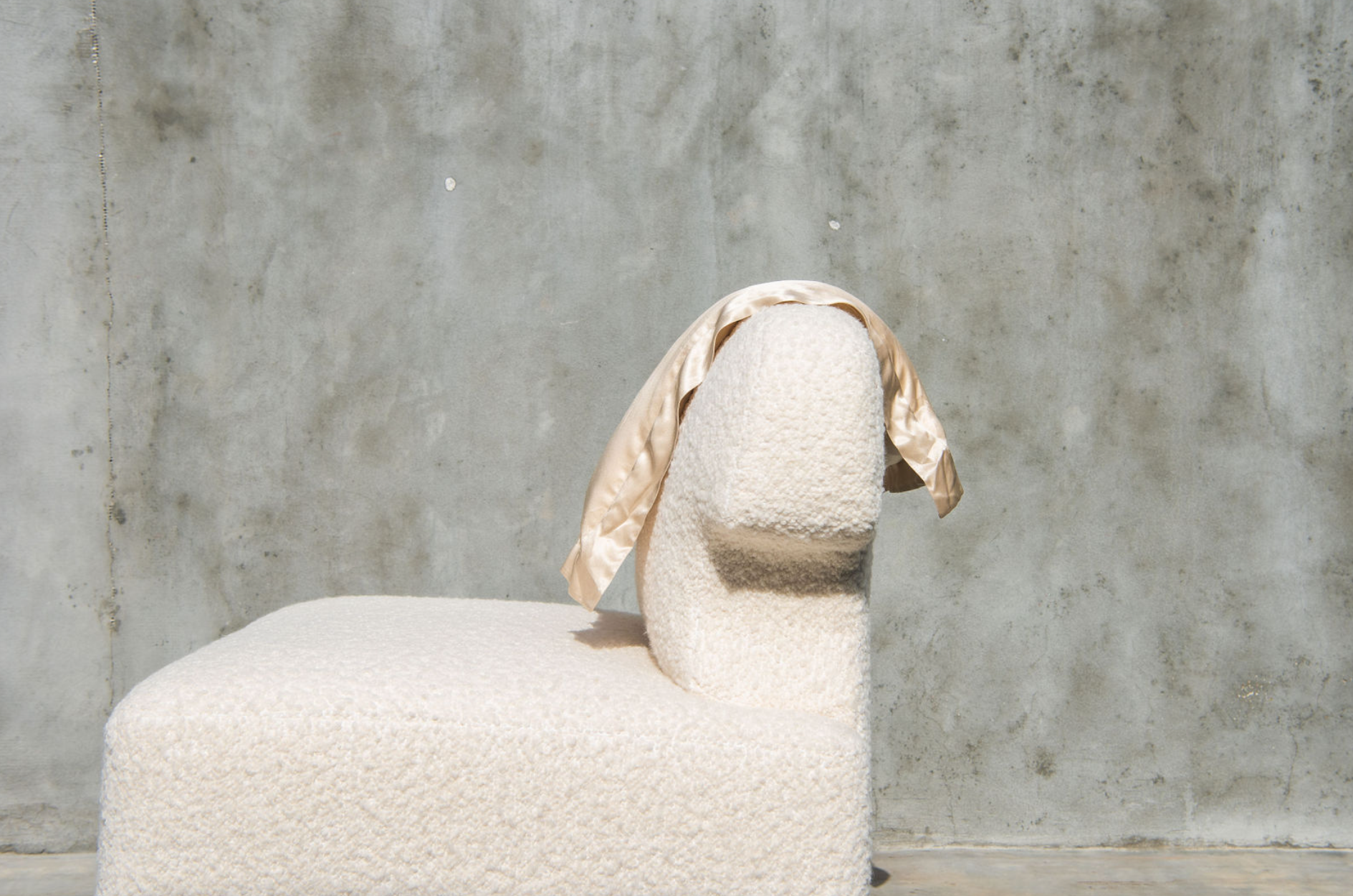 Side view of cream boucle chair by Rue & Williams an alternative to Mitchell Gold & Bob Williams